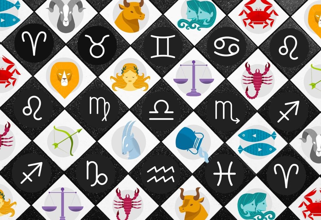 Rueda del zodiaco con los doce signos astrológicos sobre un fondo de estrellas